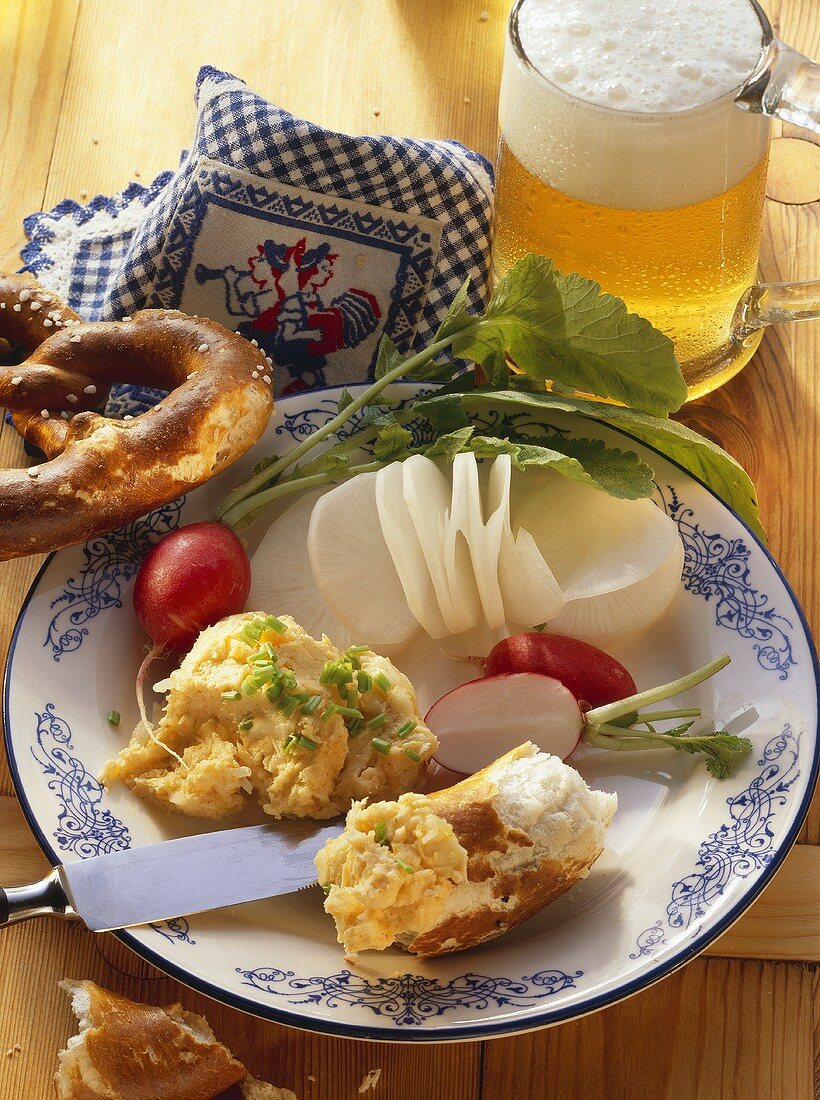 Bavarian snack: radish, cheese spread, pretzel & light beer