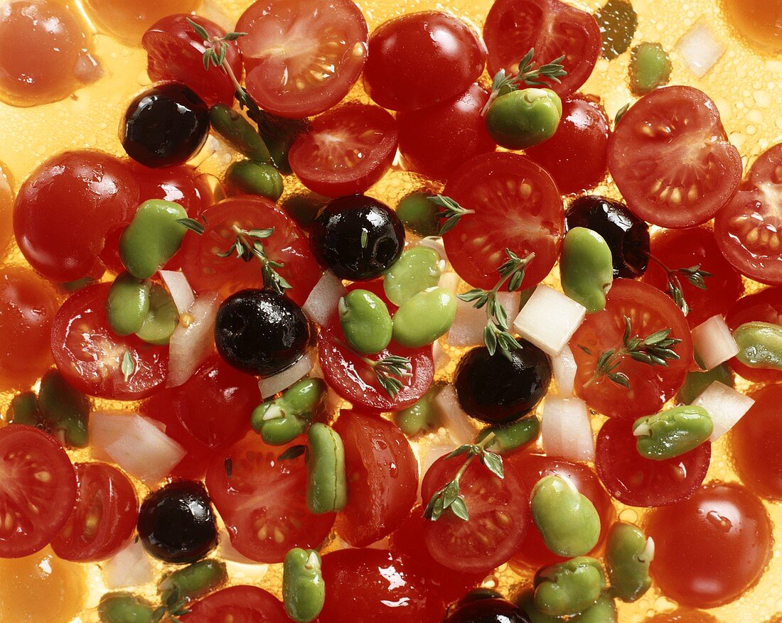 Tomato salad with olives, beans & onions (close-up)