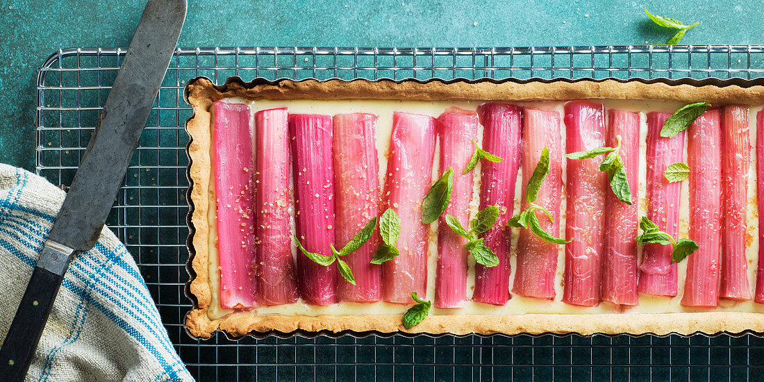 A rhubarb tart with mint leaves