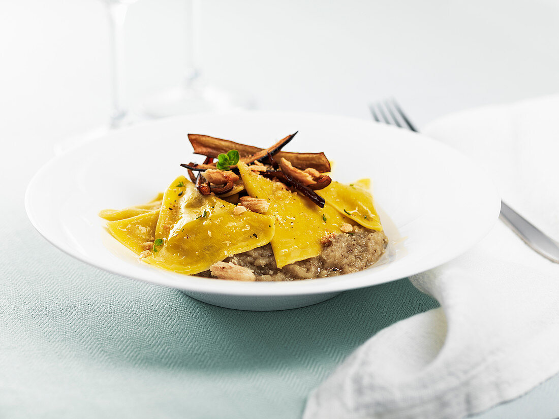 Ravioli with bufala cheese, eggplant mash and eggplant chips