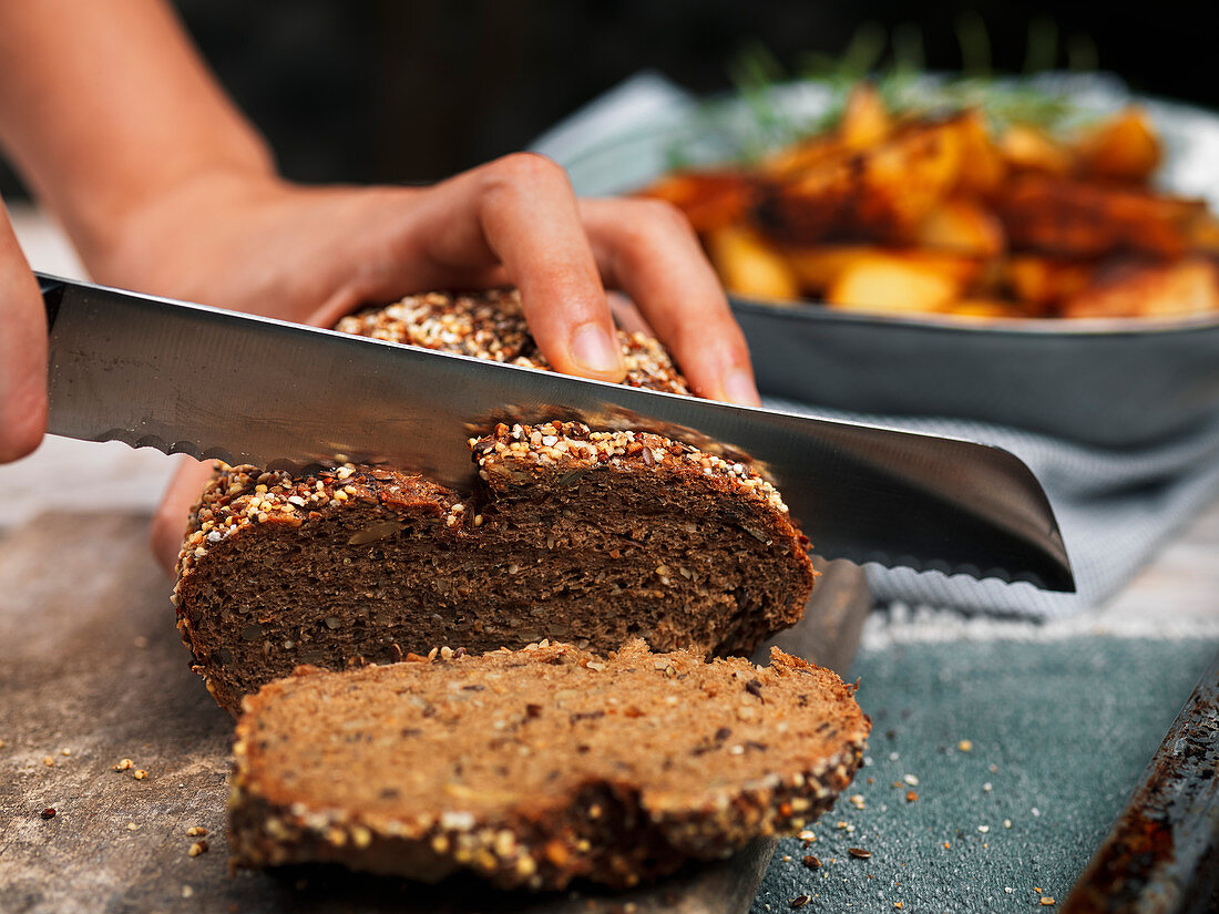 Hand cutting bread