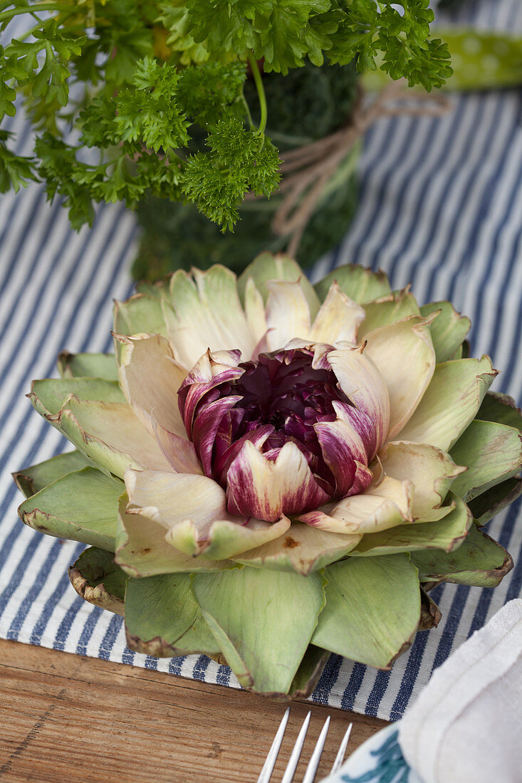 Open artichoke flower decorating table