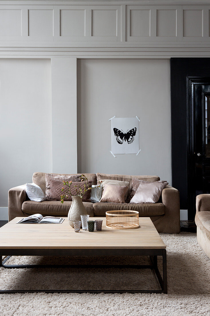 Living room in pastel shades with panelled walls