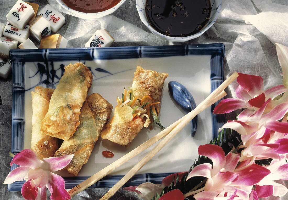 Spring Rolls on a Tray; Orchids