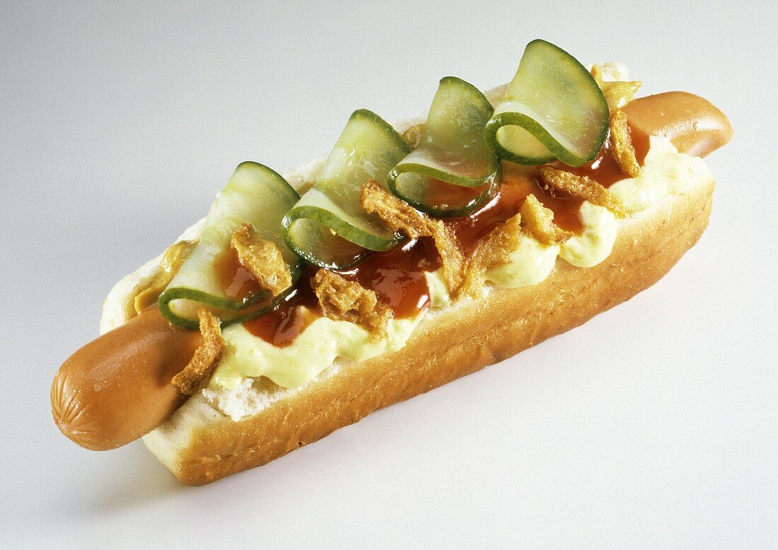 A Hot Dog on a Bun with Pickles; Condiments