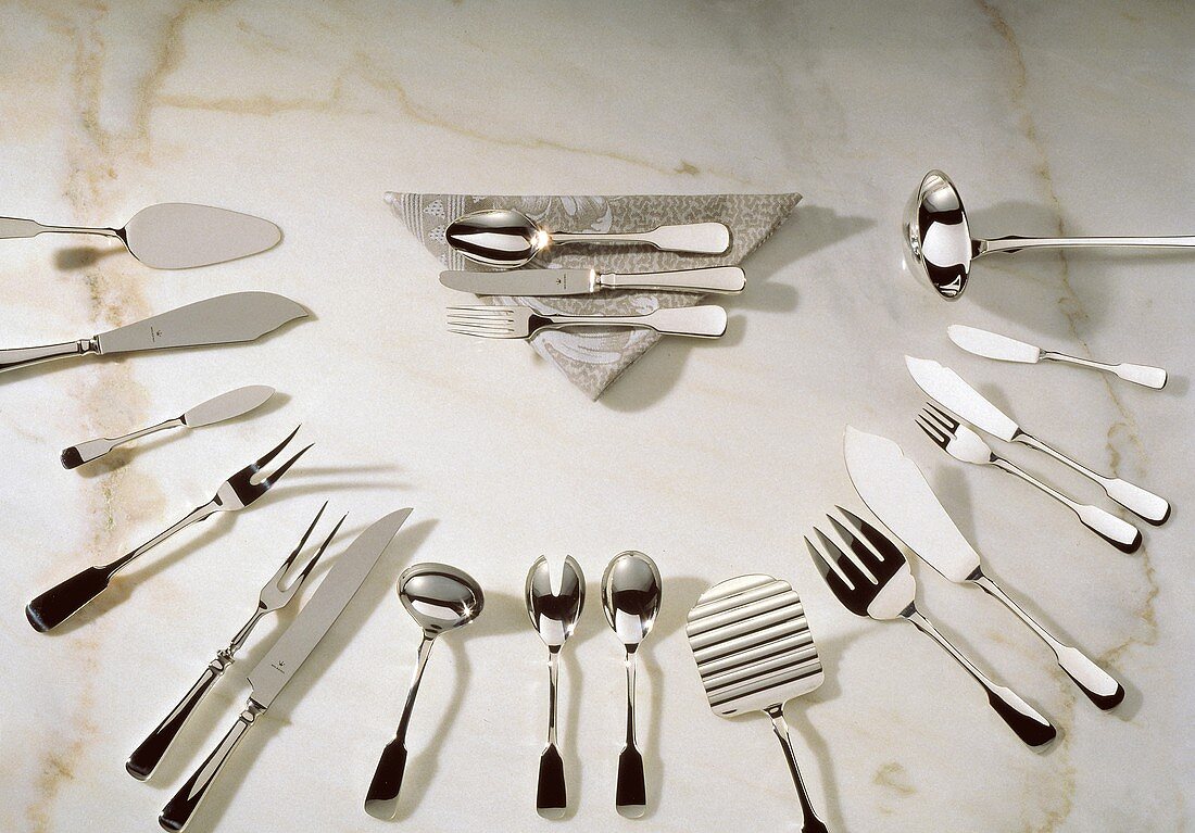 Assorted Flatware and Cutlery on Marble