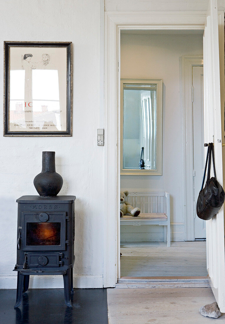 Small stove next to the door with a view of the hallway