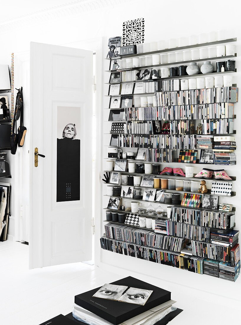 Shelf with a collection of CD's, books and bric-a-brac