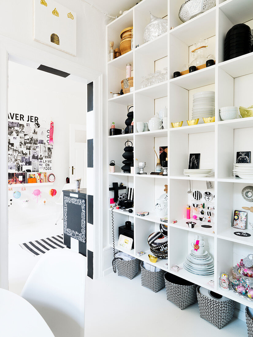 organized shelves with dishes and kitchen accessories