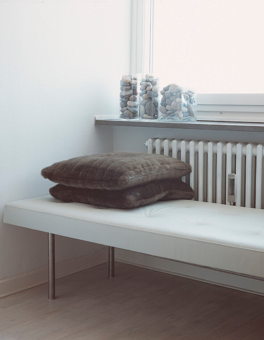 Industrial style upholstered bench in from of a radiator