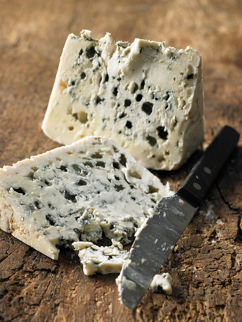 Two pieces of Roquefort with a knife