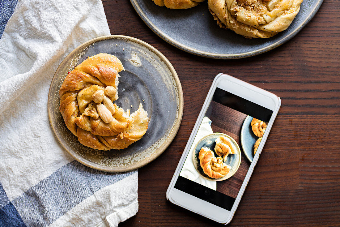 Almonds buns and a mobile phone