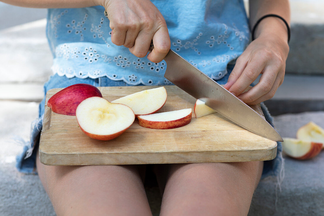 Woman cutting apples