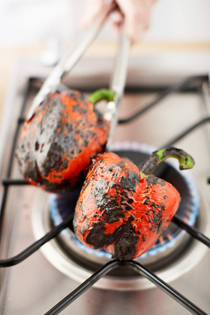 Roasting red pepper on gas flame