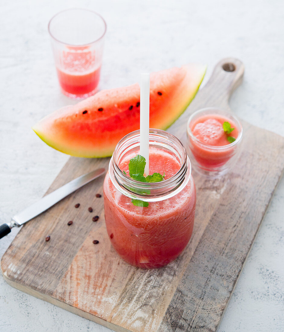 A watermelon drink on a wooden board