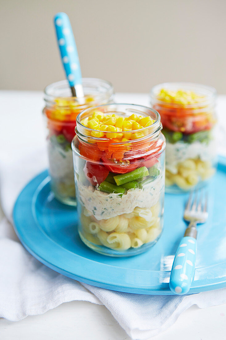 Colourful layered salad in glasses