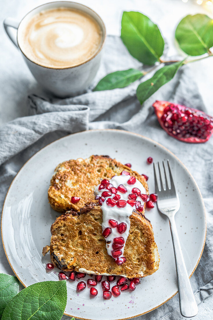 French toast with yogurt and pomegranate served with coffee