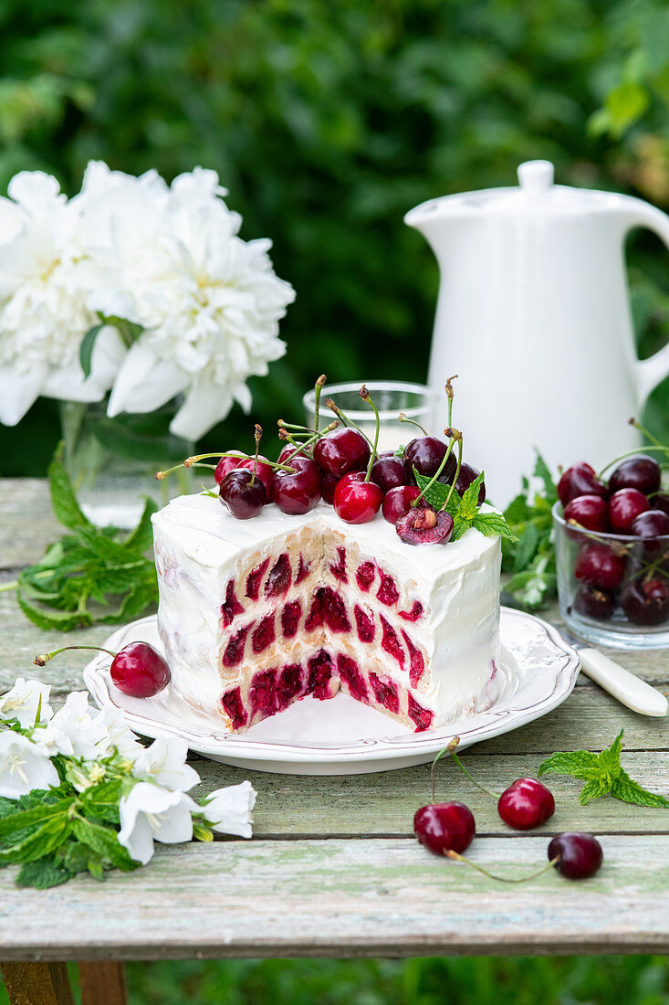 Cherry cake made with shortcrust pastry rolls (snails) and sour cream