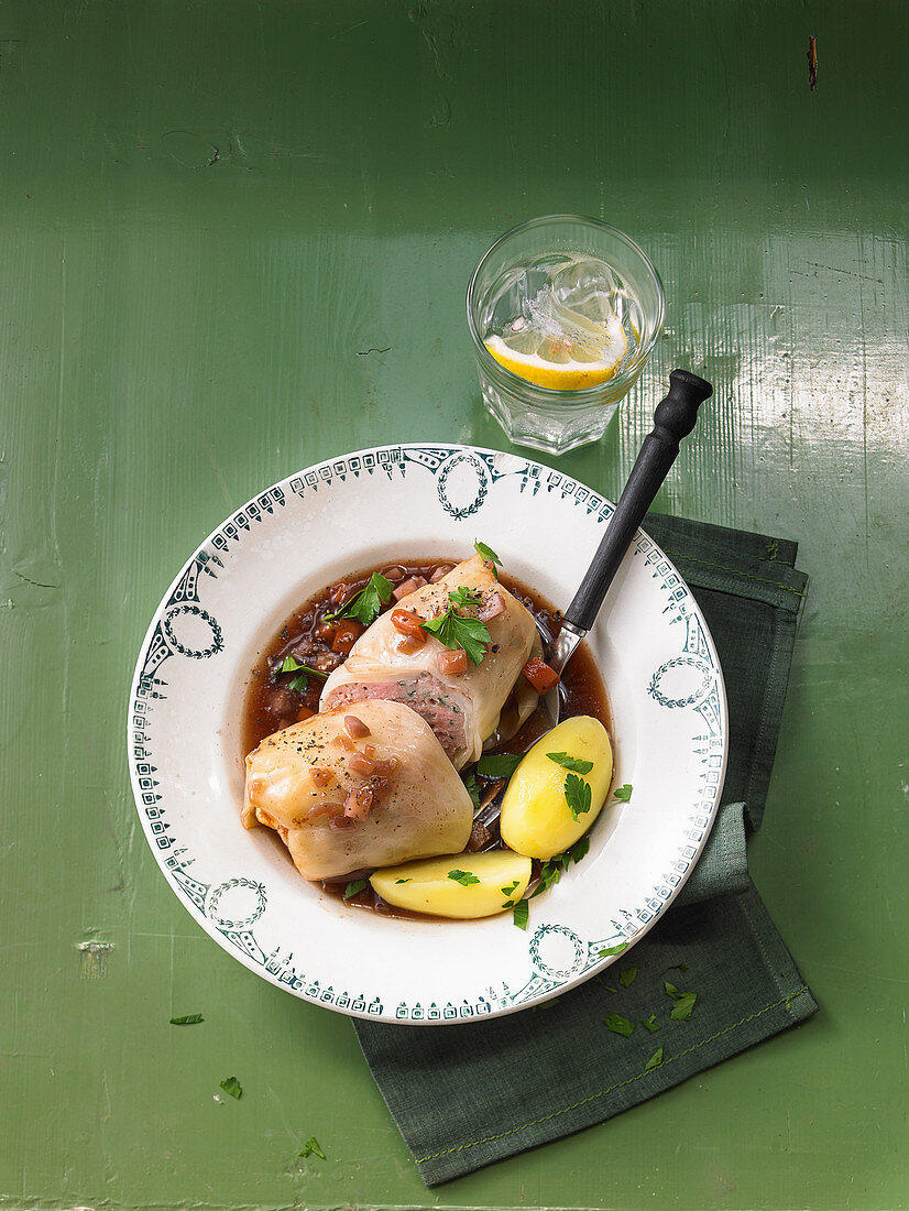 Bavarian cabbage wrapped meat with boiled potatoes