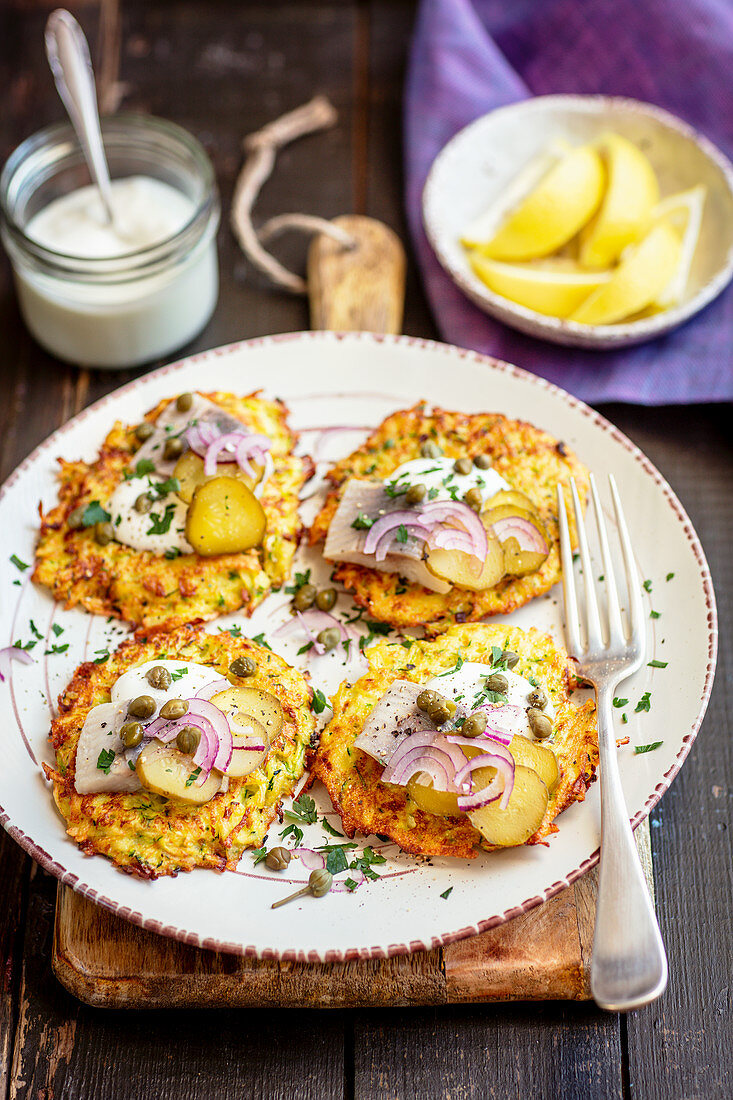 Courgette and potatoes fritters with herring