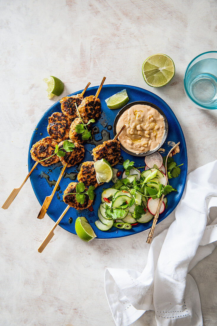Balinese minced pork satay with quick pickled cucumber salad and satay sauce
