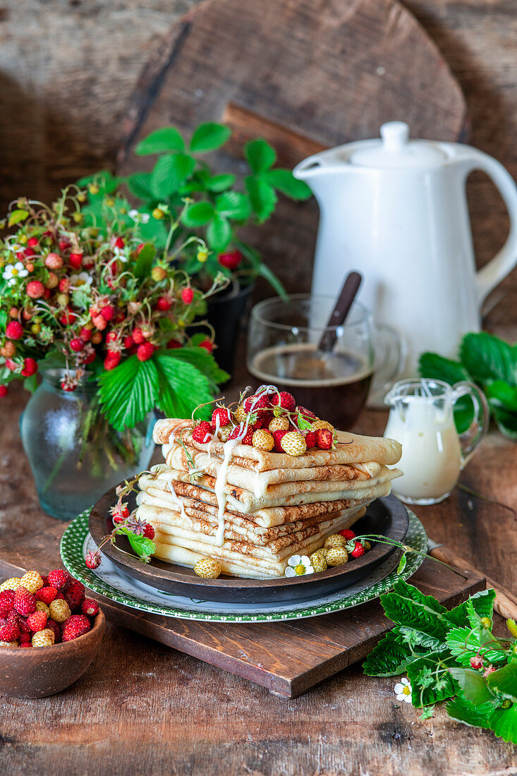 Wild strawberry crepes with creamy sauce