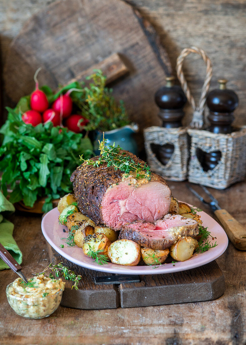 Roasted beef with potatoes and mustard butter