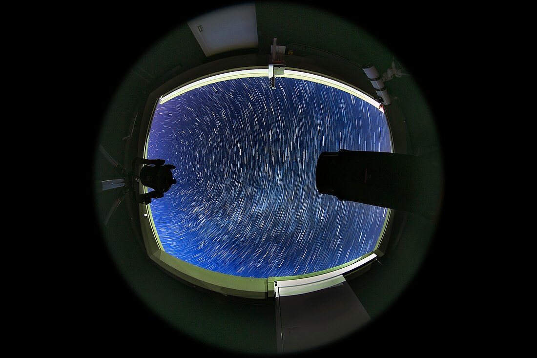 Observatory telescopes with star trails,full-dome image