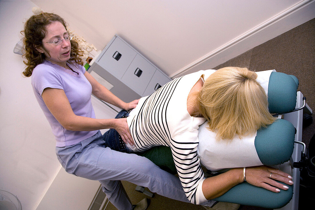 Patient being treated by a chiropractor