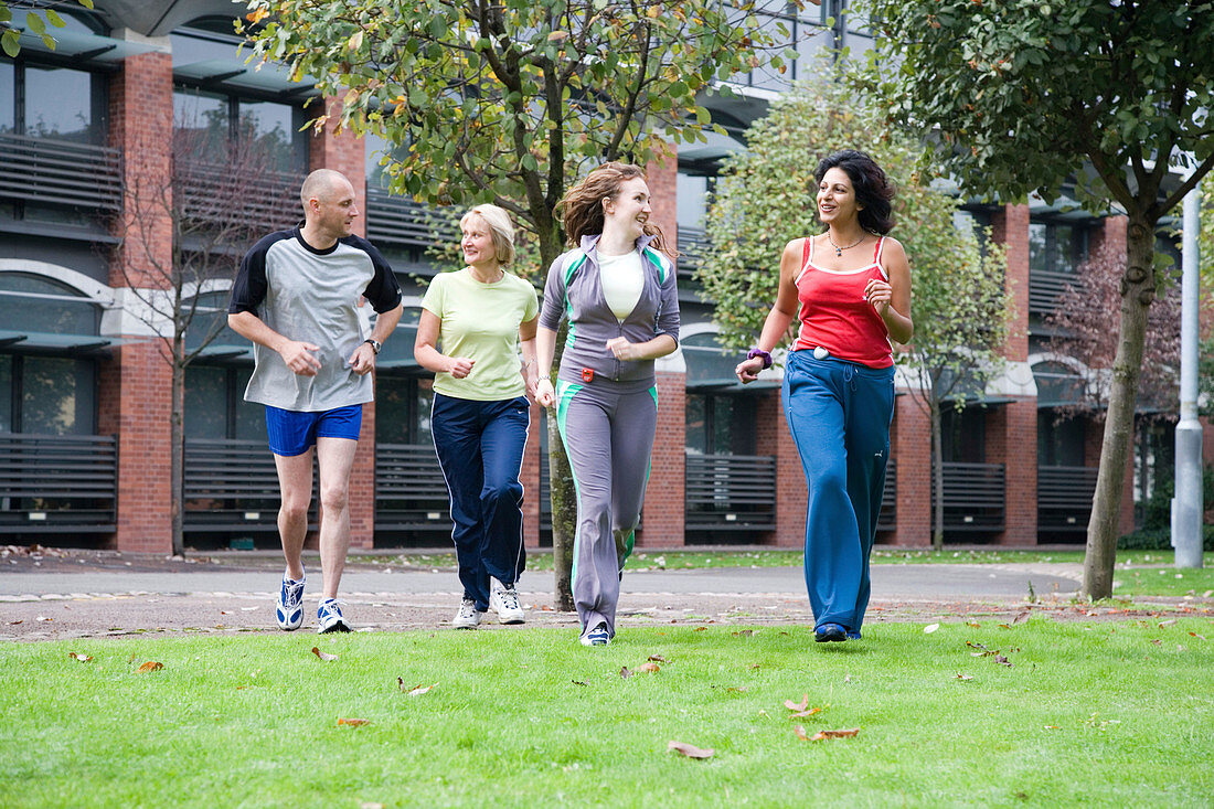 Group of adults jogging in the park