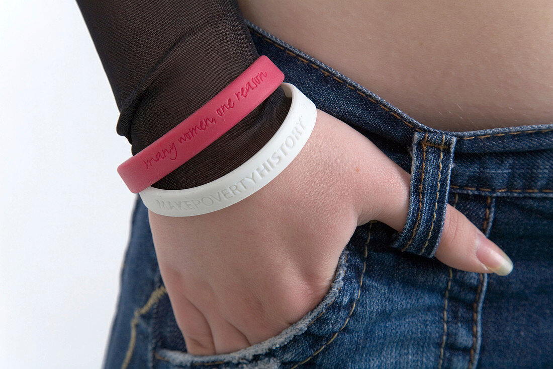 Portrait of a teenage girl wearing awareness wristbands