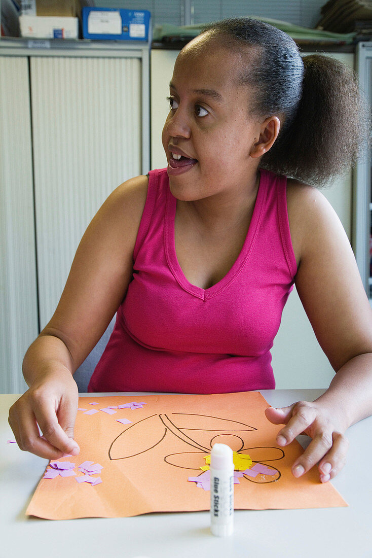 Teenage girl with learning disability in an art class