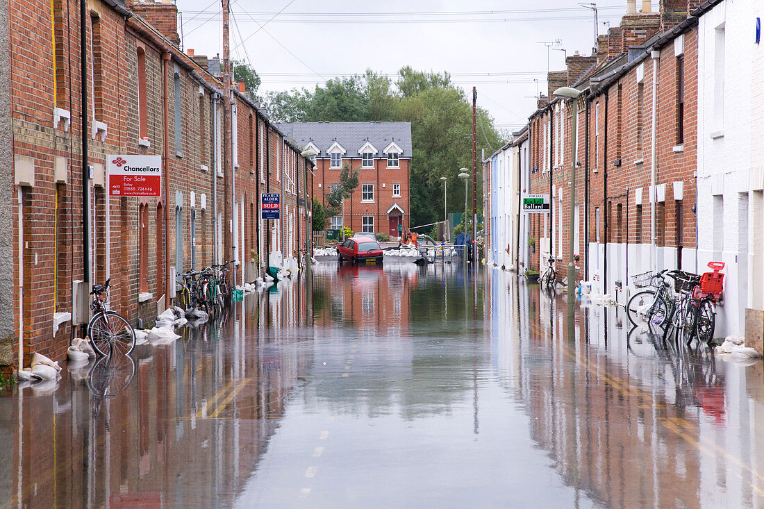 Houses in flooded street