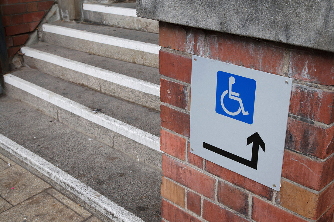 Stairs with sign for wheelchair users