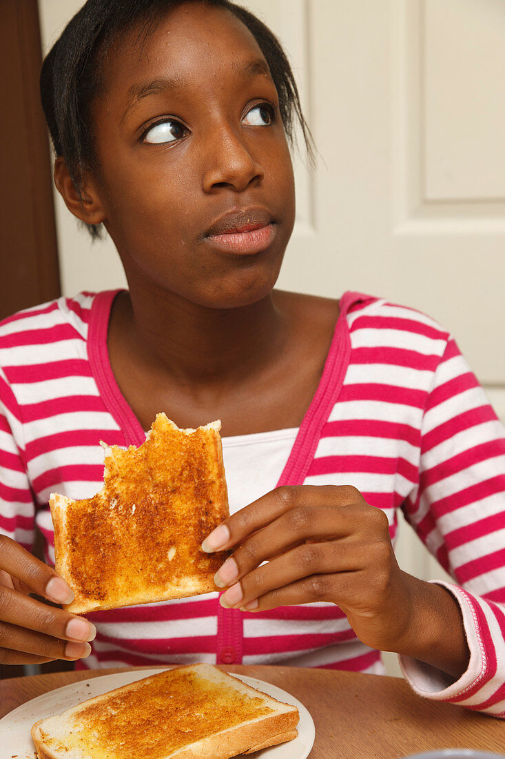Girl eating toast