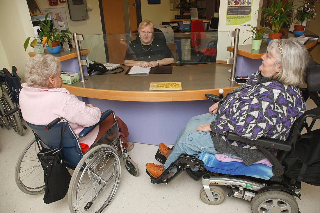 Receptionist with wheelchair users