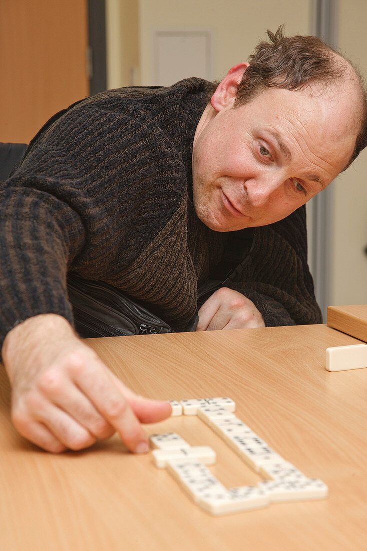 Man with disability playing dominoes