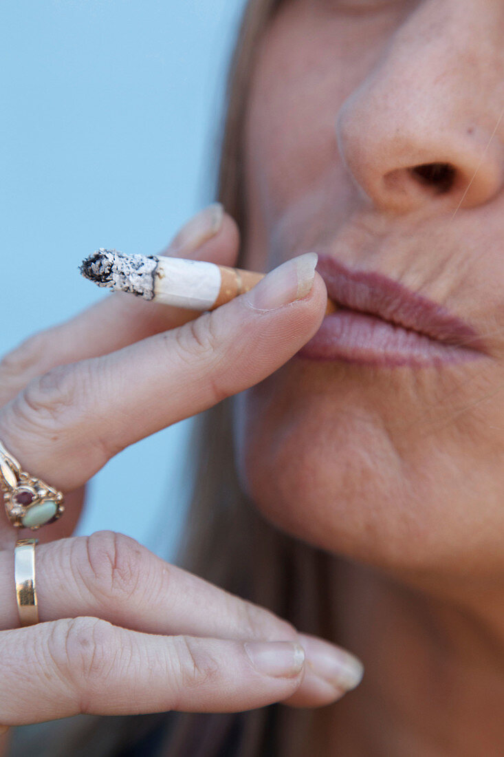 Portrait of white woman smoking
