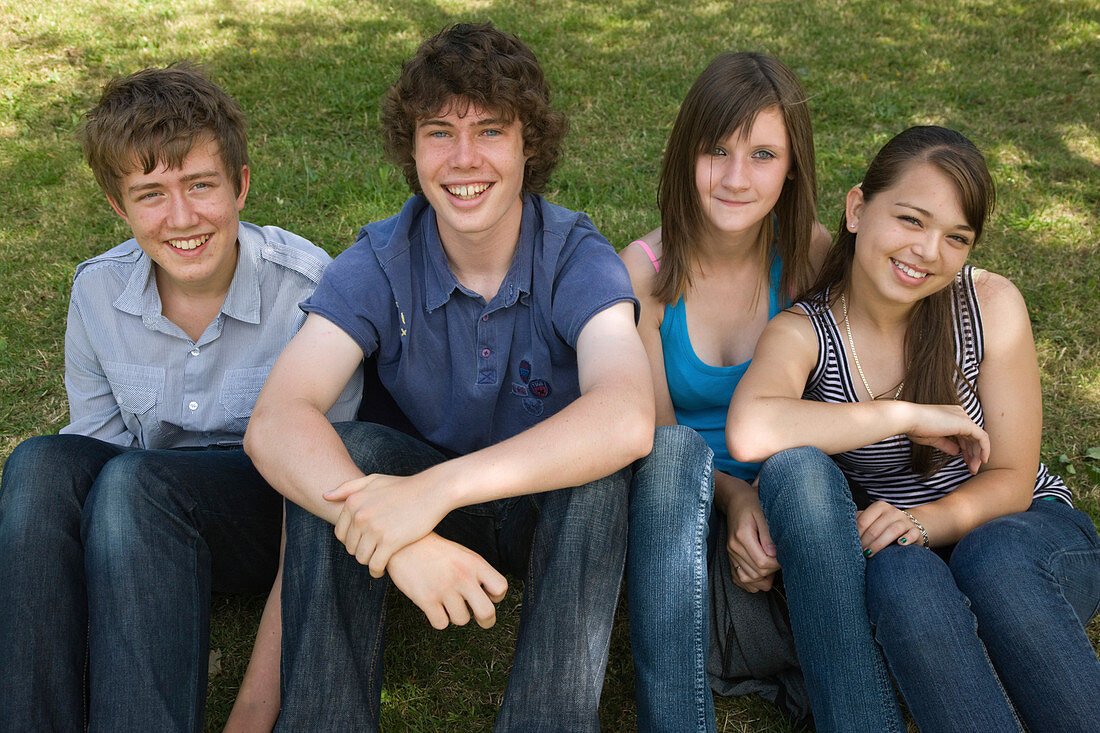 Group of teenagers smiling in the park