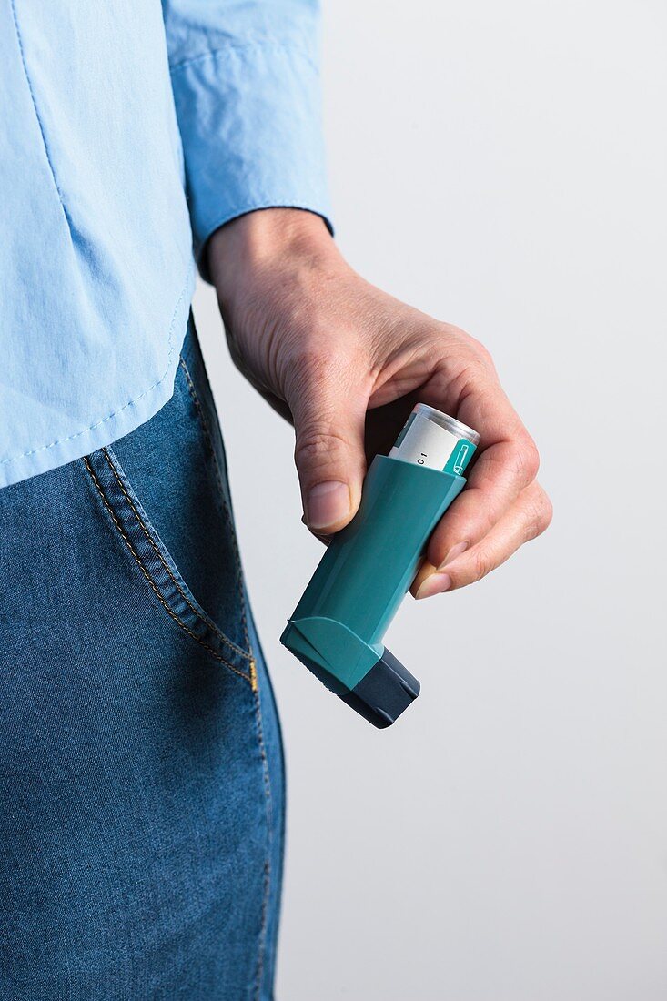 Close-up of hand holding an asthma inhaler