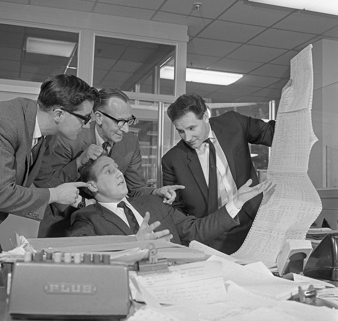 A salesman gets a helping hand in checking the figures, 1967
