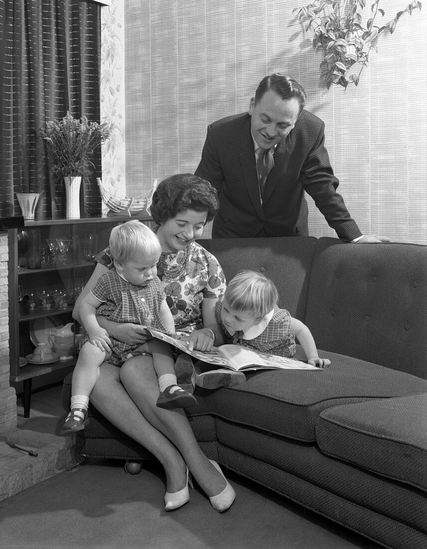 Family group looking at a brochure, 1963