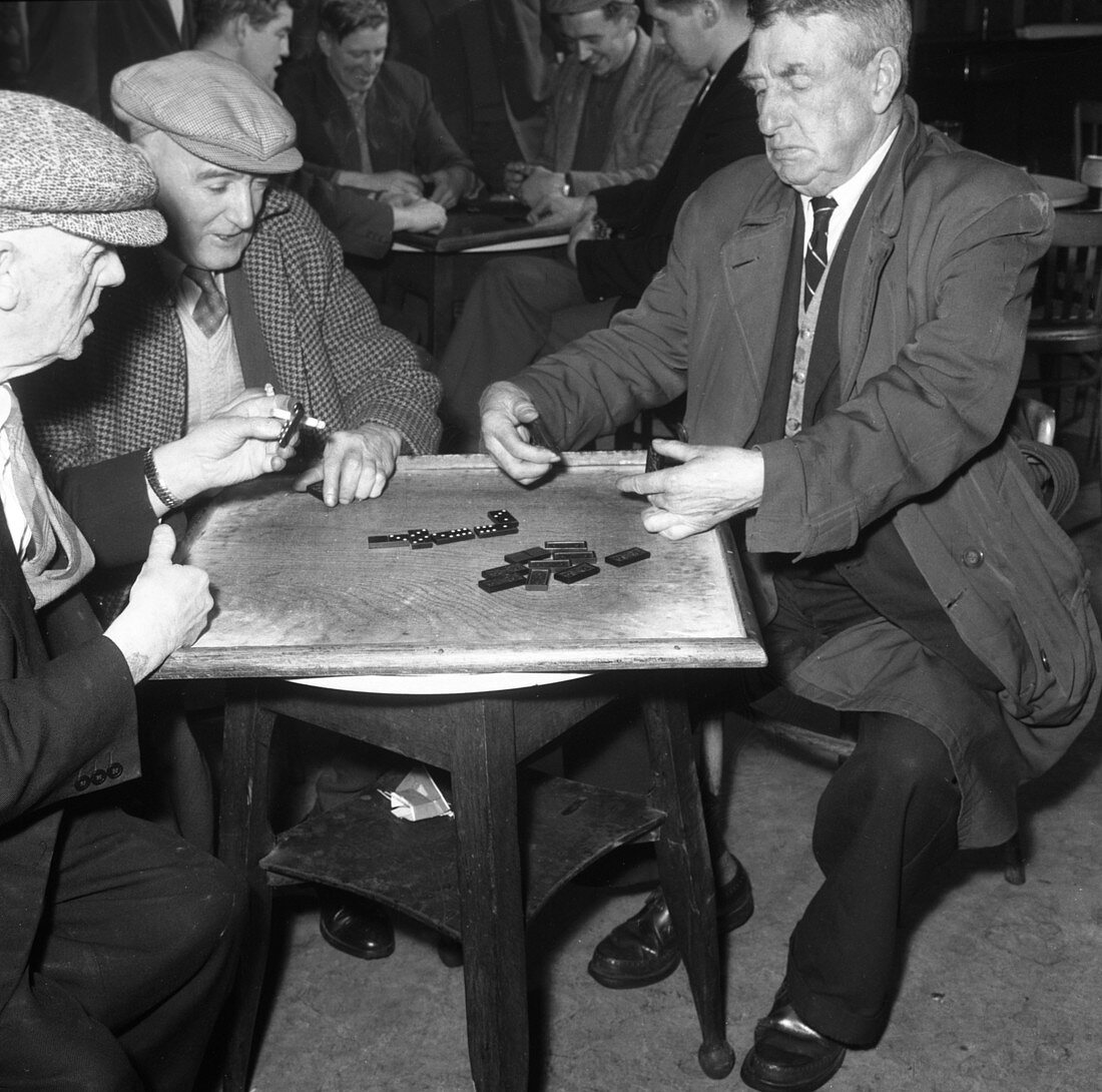 A game of dominoes in a miners' welfare club, 1963