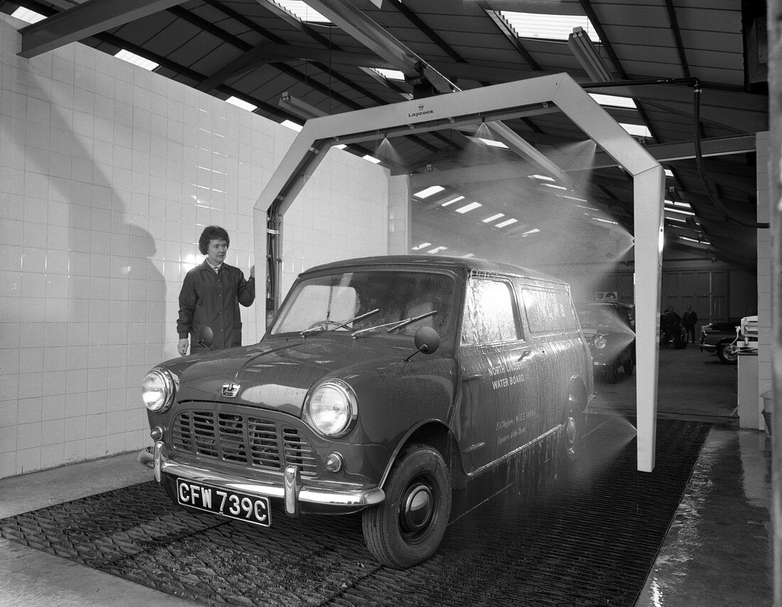 Mini van being washed in a car wash, 1965