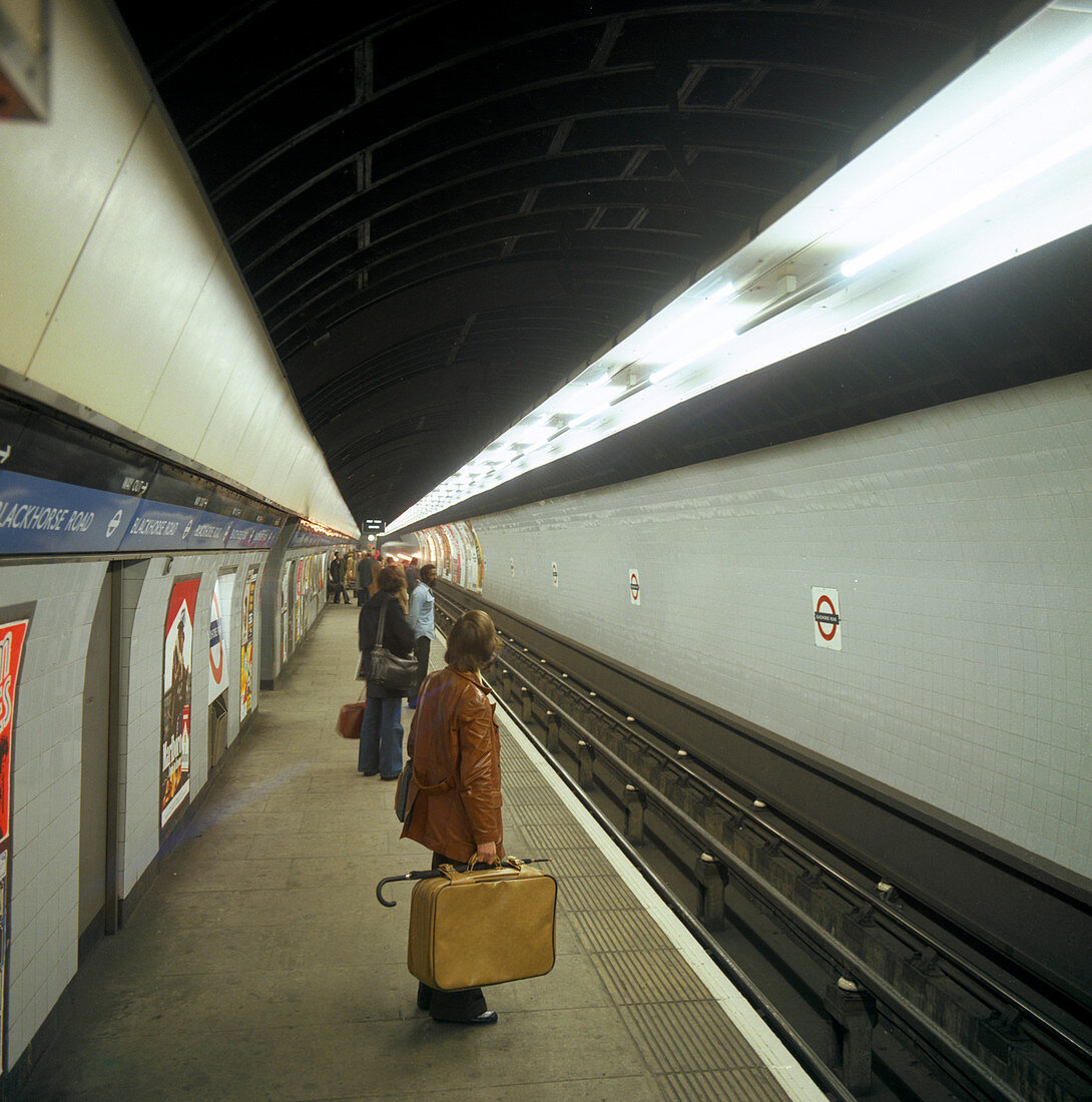 Passengers waiting at Blackhorse tube station, London, 1974