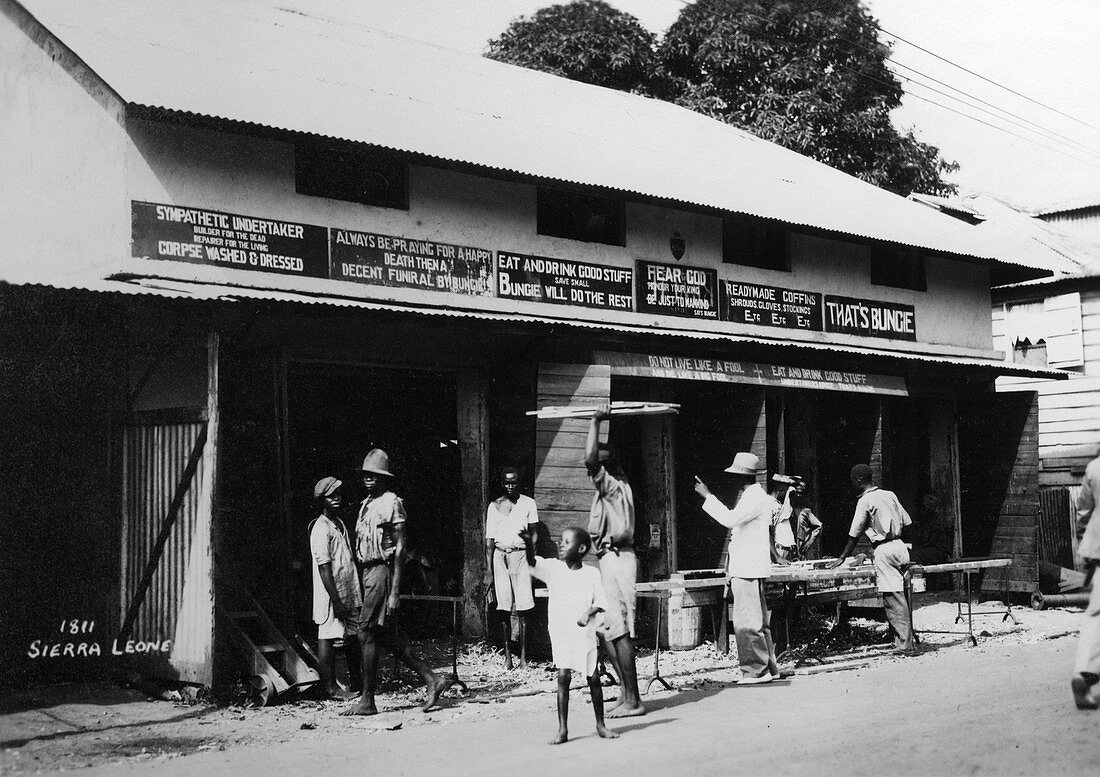 People outside an undertaker's, Sierra Leone, 20th century