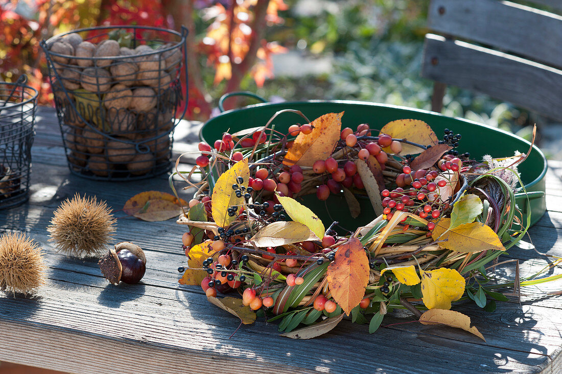 Autumn wreath with crab apples, rose hips and privet berries