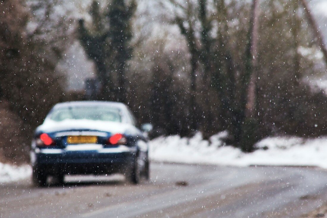 Car driving in snowy conditions