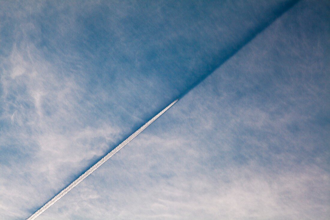 Aircraft contrail and shadow