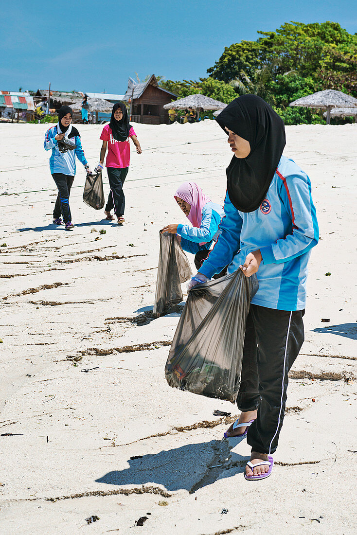 Collecting waste on a beach